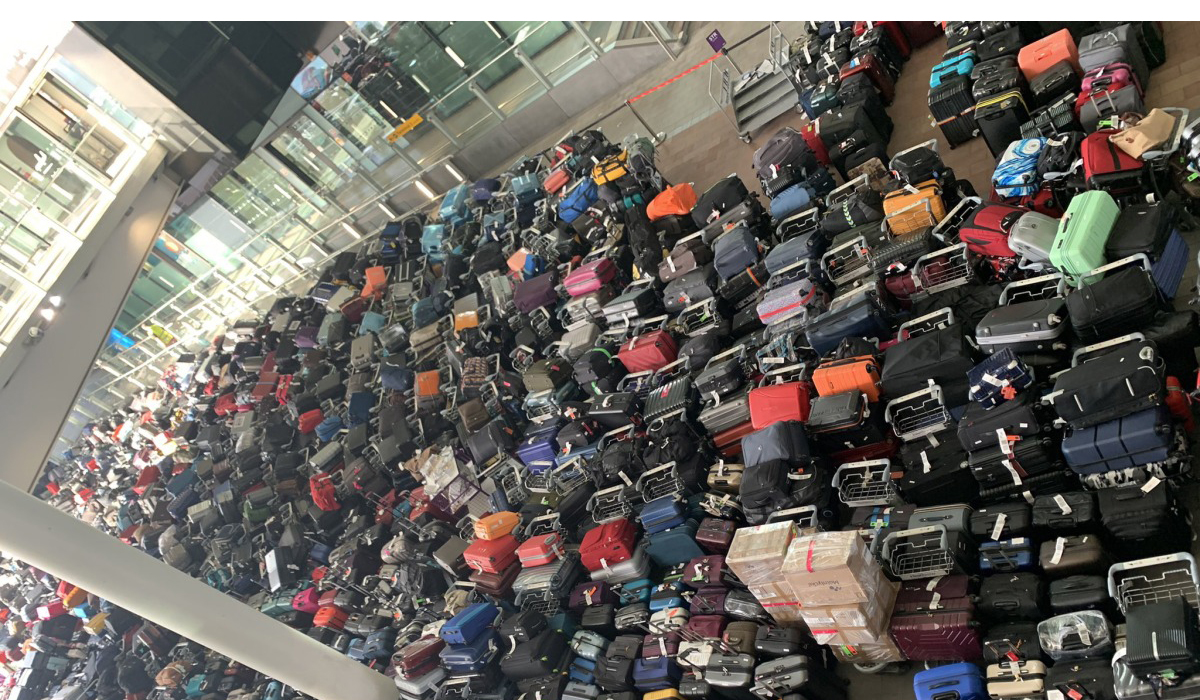 Huge suitcase pile-up at Heathrow Airport leaves thousands without bags